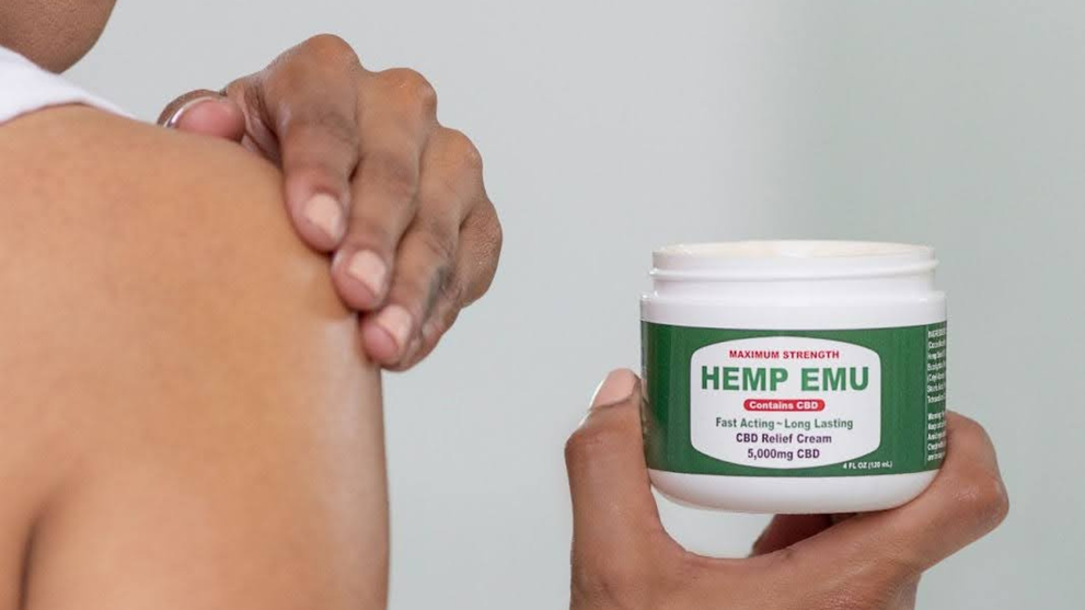 A Person Using Hemp Emu After Investigating Full Spectrum vs. Broad Spectrum CBD